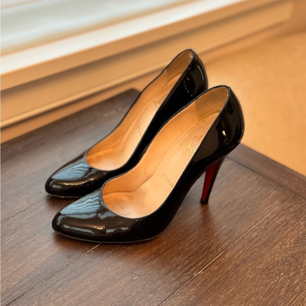 Authentic Christian Louboutin Black Patent pumps.